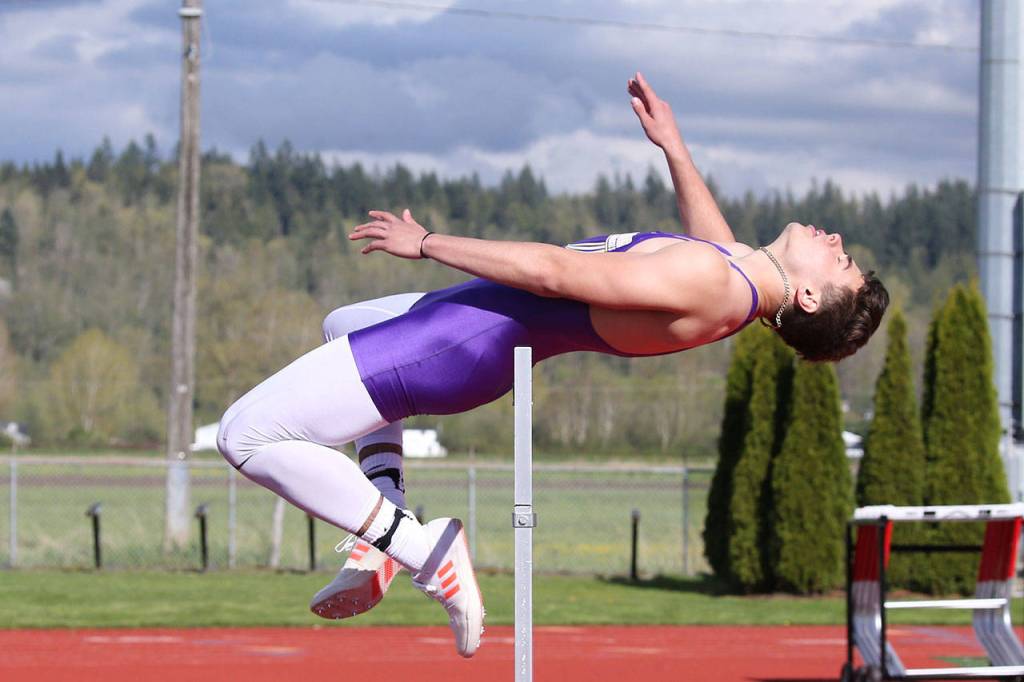 Kyle Nickols takes first in the high jump. (Photo by John Fisken)
