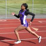 Jessica Vester runs the 400 meters for the Wildcats. (Photo by John Fisken)