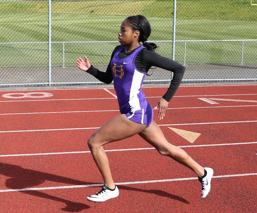 Jessica Vester runs the 400 meters for the Wildcats. (Photo by John Fisken)