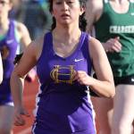 Carolynn Wicker runs to second place in the 800. (Photo by John Fisken)