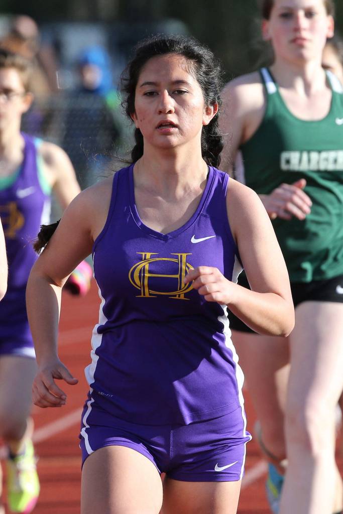 Carolynn Wicker runs to second place in the 800. (Photo by John Fisken)