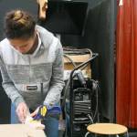 Guitar-building student Mikhaela Cortez works on her guitar last month. Photo by Daniel Warn/Whidbey News-Times
