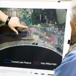 Jessica Larson points out where hairy willow-herb has gained its largest foothold on the eastern portion of the Crockett Lake Wetland Preserve. The semi-aquatic perennial herb spreads through windblown seeds and thick rhizomes underground. Photo by Ron Newberry/Whidbey News-Times