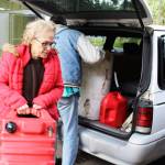 Freeland residents, Bob Brower and Debra Whitson, get help disposing of 90 gallons of gasoline that had been sitting on a fishing boat they just purchased. Photo by Patricia Guthrie/Whidbey News-Times