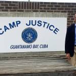 Submitted photo                                Island County Prosecutor Greg Banks stands next to the Camp Justice sign during his recent trip to Guantanamo Bay.