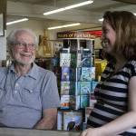 Eugene Phelps, owner of Gene&rsquo;s Art & Frame, in his Oak Harbor store Thursday, May 4, 2017 along with store manager Linnane Armstrong. Phelps has been in business for 50 years. The store is celebrating its 50th anniversary in June. Photo by Ron Newberry/Whidbey News-Times.