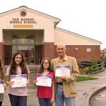 Photo by Stuart Bassett                                From left, students Natalie Ballard, Anissa Randolph, Danelle Hays and their science teacher, Alan Bailey, show off certificates of the team&rsquo;s first-place win in the eCYBERMISSION competition.