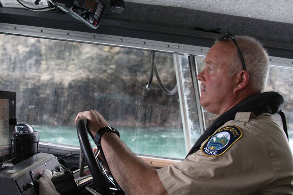 Ralph Downes, enforcement officer with Washington Department of Fish and Wildlife, passes through Canoe Pass underneath the Deception Pass bridge Wednesday, May 10, 2017, while out on patrol. Photo by Ron Newberry/Whidbey News-Times