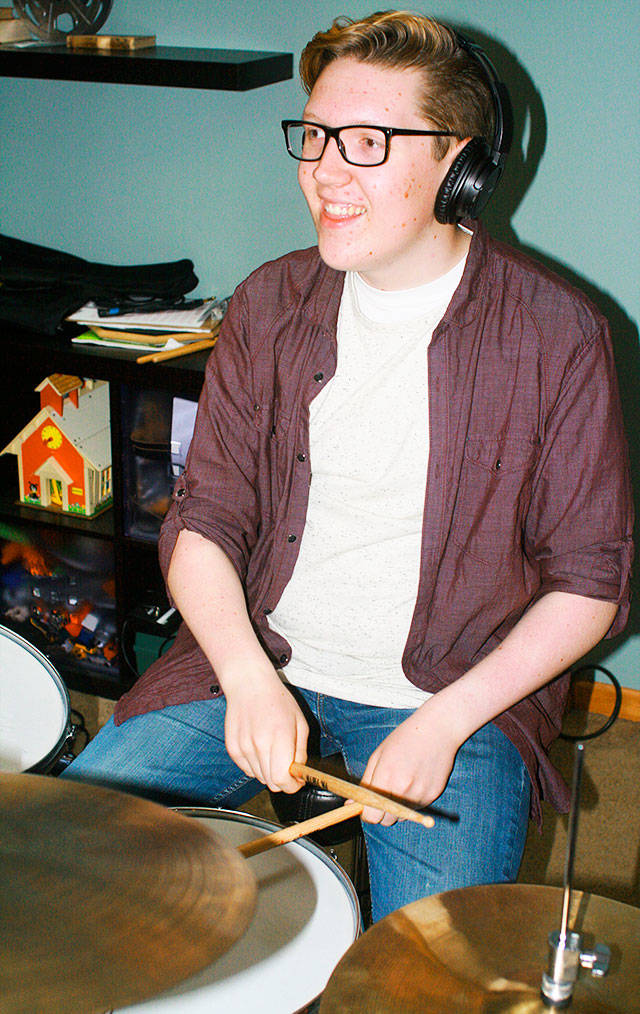 Samuel Gibbon plays drums for Backyard Bison at a band practice last week. Photo by Daniel Warn/Whidbey News-Times