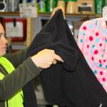 Volunteer Delaney Geist sorts through donated items at the Garage of Blessings in Oak Harbor, Thursday, May 18, 2017. The nonprofit thrift store will be moving to its sixth location in June. Photo by Ron Newberry/Whidbey News-Times