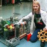Oak Harbor High School sophomore Marcus Carmen demonstrates some of the capabilities of the robot he and Whidbey Island Wildcats Robotics Club engineered. The robotic club brought their creation to Hillcrest Elementary&rsquo;s STEM Family Night Friday in order to inspire the younger kids to get involved with engineering. Photo by Daniel Warn/Whidbey News-Times