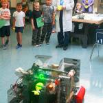 Tristen Klein, a junior at Oak Harbor High School, took point in demonstrating Whidbey Island Wildcats Robotics Club&rsquo;s robot to a crowd of elementary students Friday night at Hillcrest Elementary, which was holding a STEM Family Night in the hopes of inspiring students to pursue STEM-related careers. Photo by Daniel Warn/Whidbey News-Times