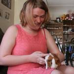 Anastasia Drake is tickled with her a new guinea pig, Sirius, at her Oak Harbor home Monday, May 22, 2017. Drake was distraught over the weekend after her longtime guinea pig Spice died. The Oak Harbor police brought her a new one to cheer her up. Photo by Ron Newberry/Whidbey News-Times.