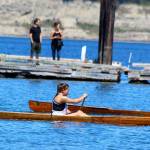 Two competitors cross paths in the single woman race during Saturday&rsquo;s Penn Cove Water Festival. Canoe races ranged from one person to 11-person crews. Photos by Patricia Guthrie/Whidbey News-Time