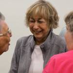 Anne Weaver, center, laughs while listening to Kathleen Anderson, left, at the Coupeville School Board meetingMonday. Weaver is retiring after 38 years in the Coupeville district. Photo by Ron Newberry/Whidbey News-Times