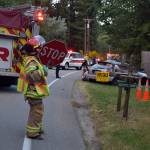 Kyle Jensen / The Record &mdash; A South Whidbey Fire/EMS responder blocks the scene of the wreckage Monday night. The collision left a Lake Stevens woman dead and a Clinton man in Island County Jail.