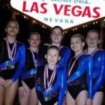 The Island Flyers show off their medals won in Las Vegas. From the left are Amaya Martin, Kaitlyn Rozycki, Catrina Ocanas, Harmony Wertz and Cassidy Gore. In front is Sakura Hogan. (Photo by Hiroko Hogan)