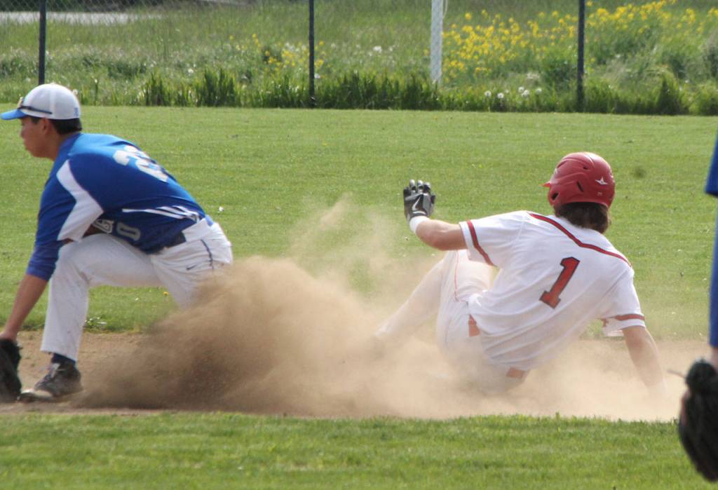 Clay Reilly steals second base for the Wolves. (Photo by Jim Waller/Whidbey News-Times)