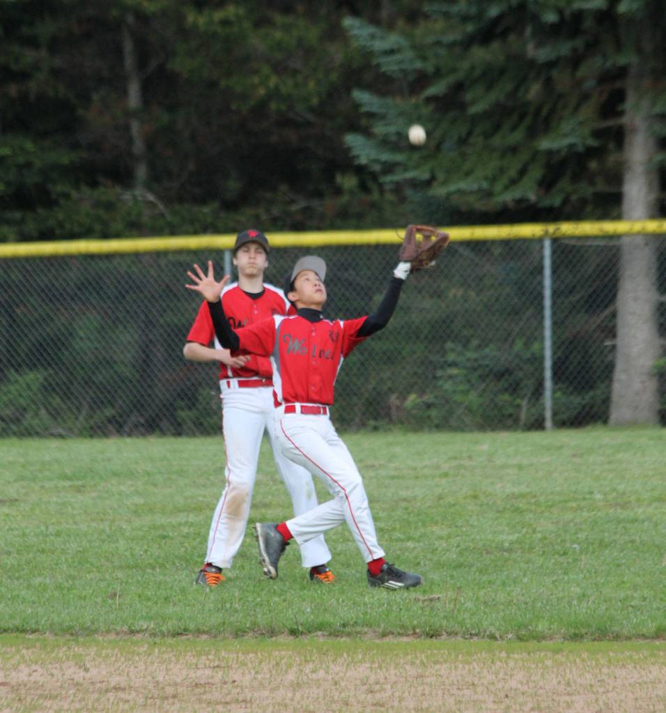 Coupeville shortstop George Dailey catches a pop-up in shallow center field. (Photo by Jim Waller/Whidbey News-Times)