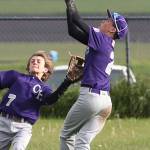 Oak Harbor shortstop Gage McLeod grabs a pop-up in front of left fielder Aidan Golden. (Photo by John Fisken)