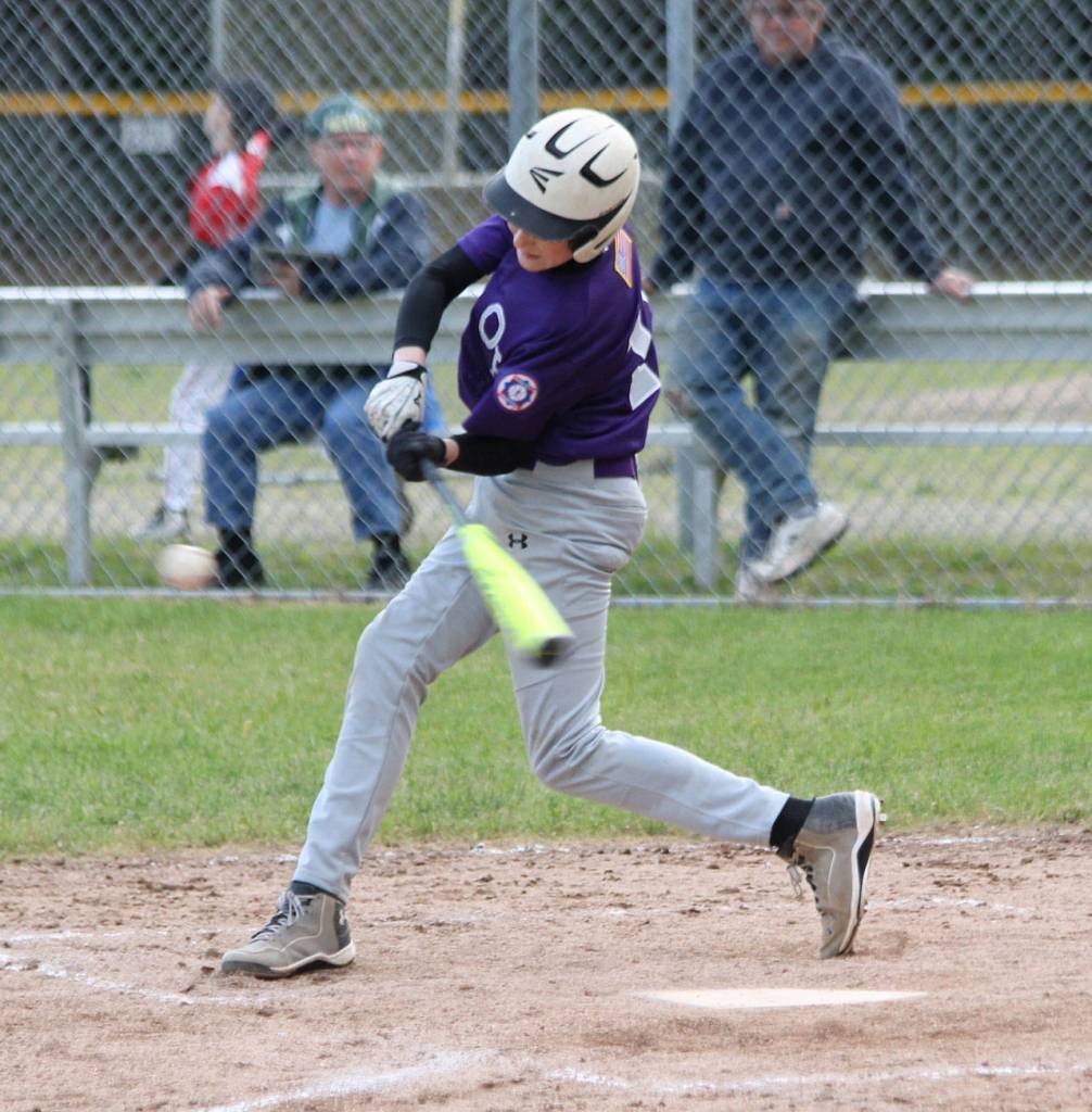 Will Rankin singles for Oak Harbor. (Photo by Jim Waller/Whidbey News-Times)