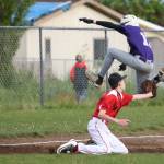 Will Rankin tries to jump over the tag of Coupeville third baseman Xavier Murdy. (Photo by John Fisken)