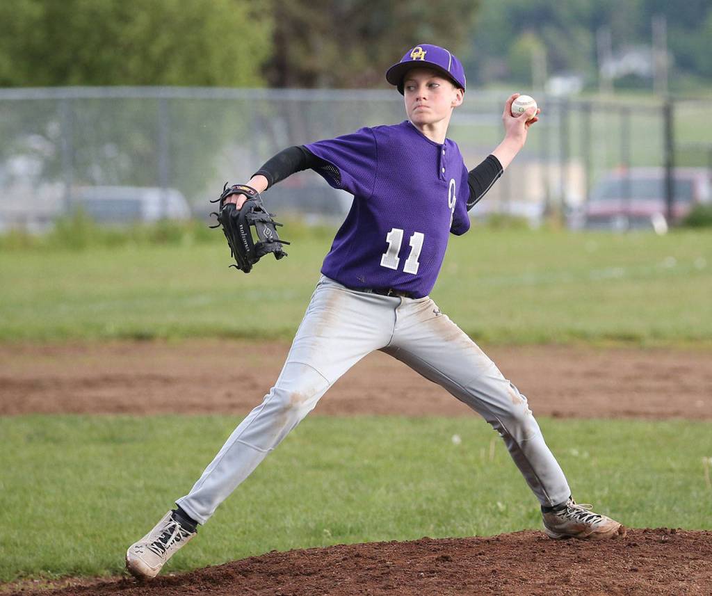 Will Rankin fires a pitch for Oak Harbor. (Photo by John Fisken)