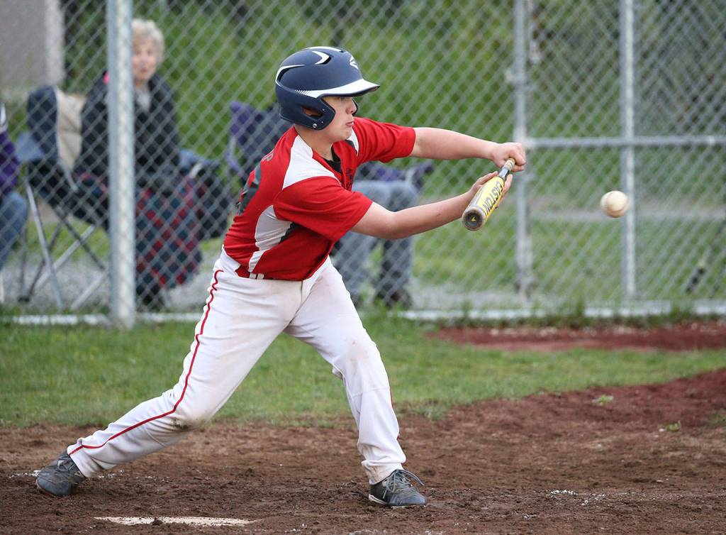 Sage Sharp puts down a bunt for Coupeville. (Photo by John Fisken)
