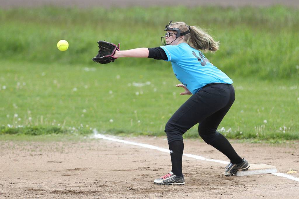 Central Whidbey&rsquo;s Marenna Rebischke-Smith forces a runner at first. (Photo by John Fisken)