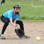 Central Whidbey&rsquo;s Stella Johnson scoops up a grounder. (Photo by John Fisken)