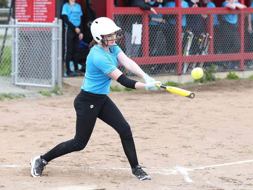 Melody Wilkie smacks a fly ball Wednesday. (Photo by John Fisken)