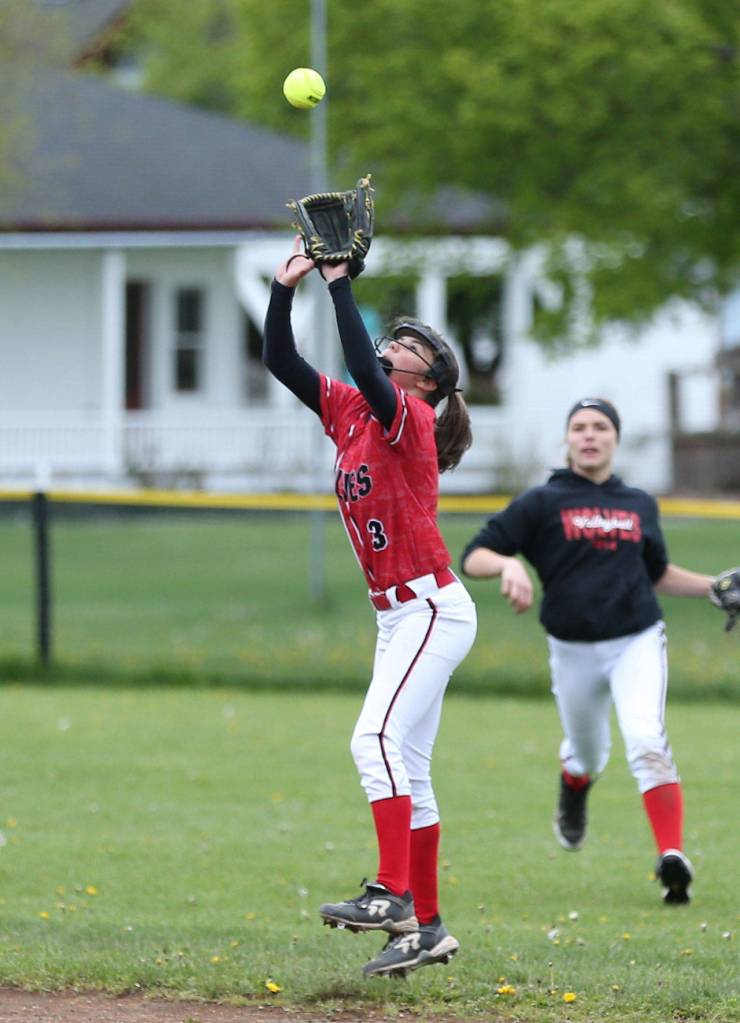Second baseman Jae LeVine catches a popup in front of center fielder Hope Lodell. (Photo by John Fisken)