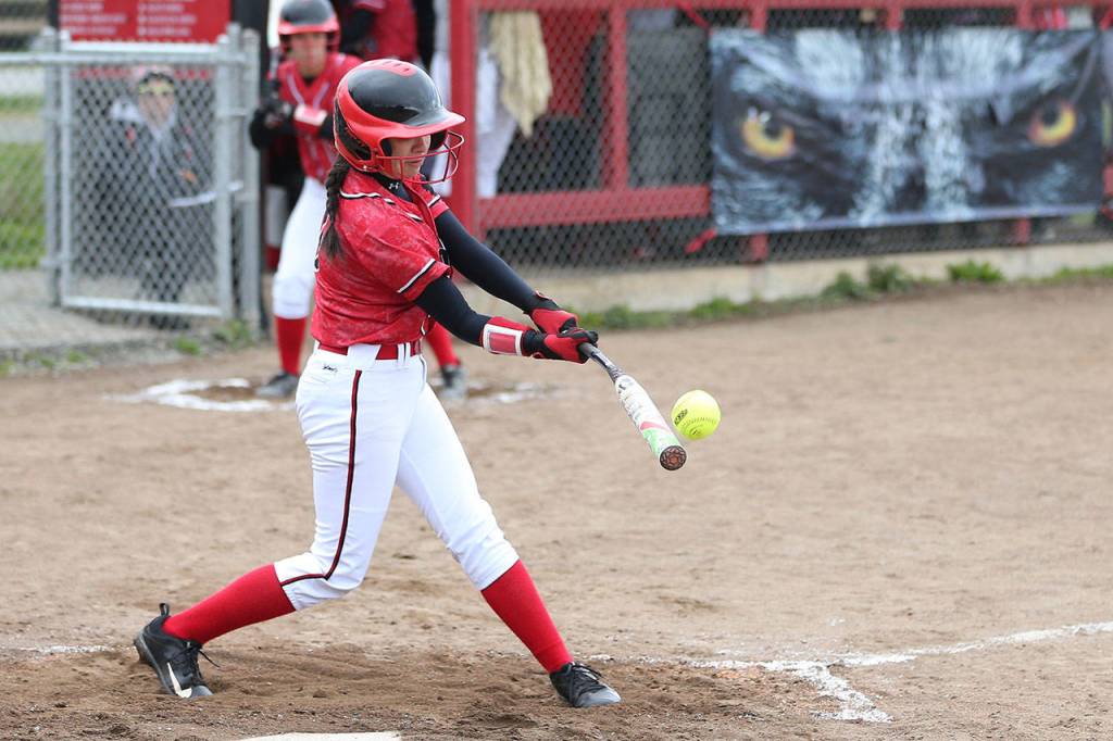 Robin Cedillo put the ball in play for the Wolves. (Photo by John Fisken)