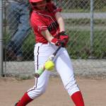 Senior Robin Cedillo puts the bat on the ball during Senior Night for the Wolves. (Photo by John Fisken)
