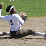 Shortstop Audrey Howard considers throwing to first after making a diving stop. (Photo by John Fisken)