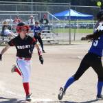 Lauren Rose beats out a bunt against Bellevue Christian. (Photo by John Fisken)