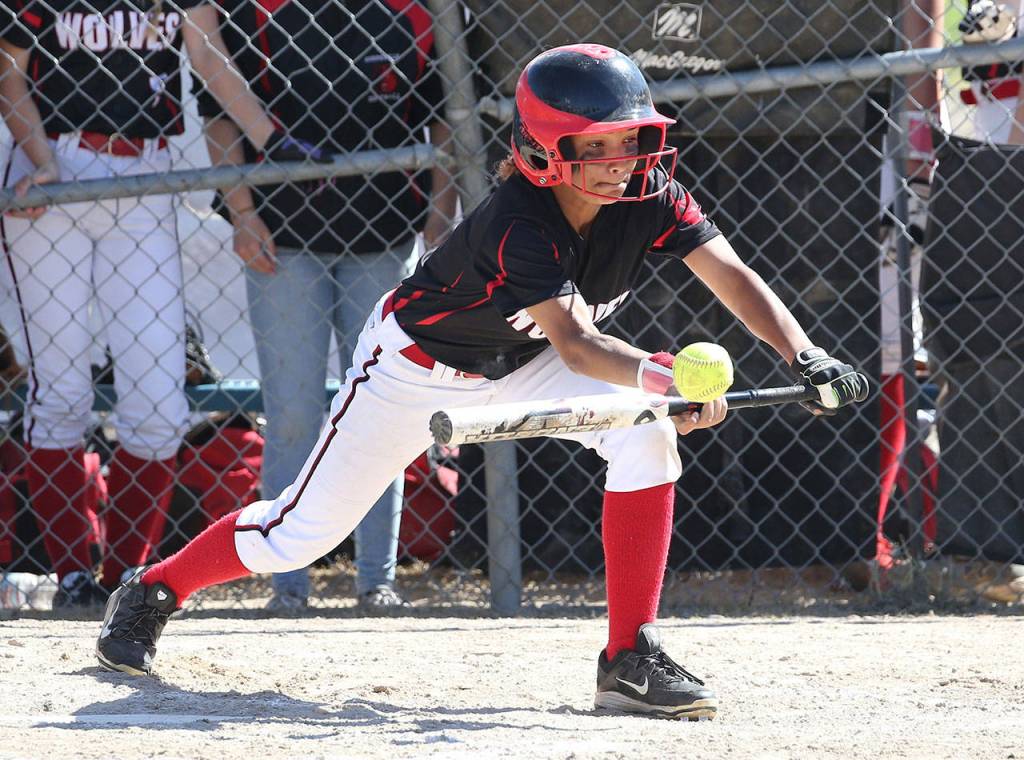 Tamika Nastali bunts for Coupeville Saturday. (Photo by John Fisken)