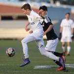 Josh Coe advances the ball for Oak Harbor. (Photo by John Fisken)