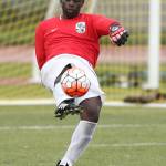 Coupeville keeper Dewitt Cole boots the ball for the Wolves. (Photo by John Fisken)