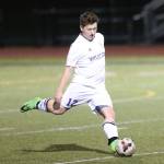 Chaz Purdy takes a free kick for Oak Harbor. (Photo by John Fisken)