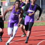 Taeson Hardin takes the baton from his brother Dorian in the 4x100 relay. They joined Andrew Miller and Jordan Washington in the event at the state meet. (Photo by John Fisken)