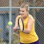 Peyton Carlson smacks a backhand for the &lsquo;Cats. (Photo by John Fisken)