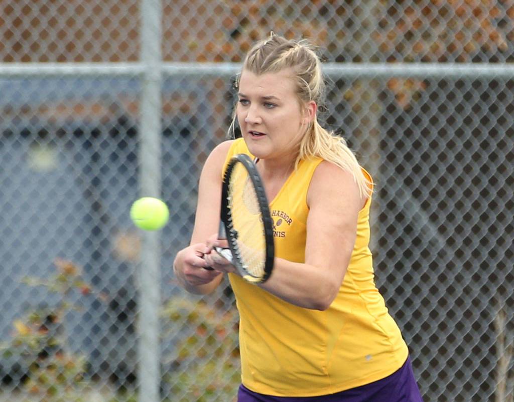 Peyton Carlson smacks a backhand for the &lsquo;Cats. (Photo by John Fisken)