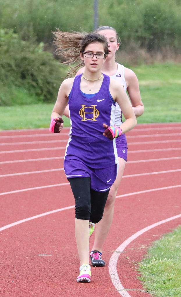Megan Smith runs to second place in the 3,200 meters. (Photo by John Fisken)