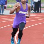 Chris Brown heads around the second turn in the 400-meter preliminaries. (Photo by John Fisken)