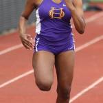Delija Cammon sprints to the finish in the JV 100 meters. (Photo by John Fisken)