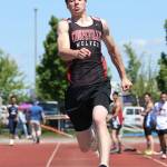 Mitchell Carroll sets a new Coupeville record in the triple jump. (Photo by John Fisken)
