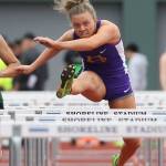 Kaitlyn Chelberg clears a hurdle in the district meet Friday. (Photo by John Fisken)