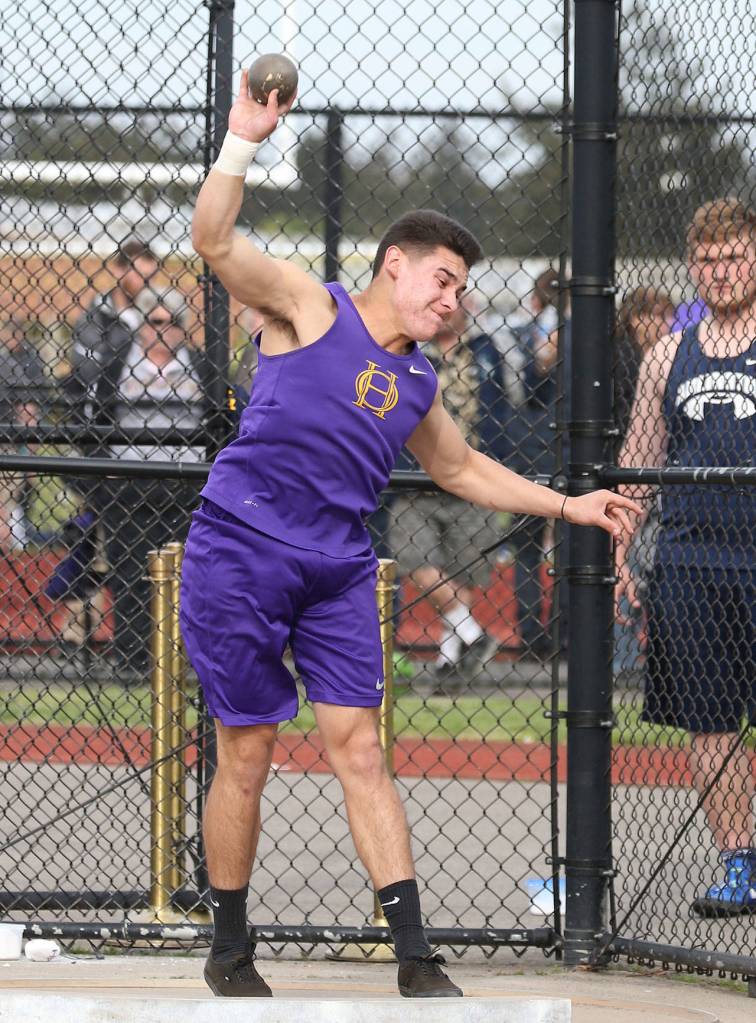 Isaac Gomez finishes sixth in the shot put at the divisional meet. (Photo by John Fisken)