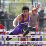 Garren Guerrero runs a preliminary heat of the 110 hurdles. He also placed fifth in the long jump finals. (Photo by John Fisken)